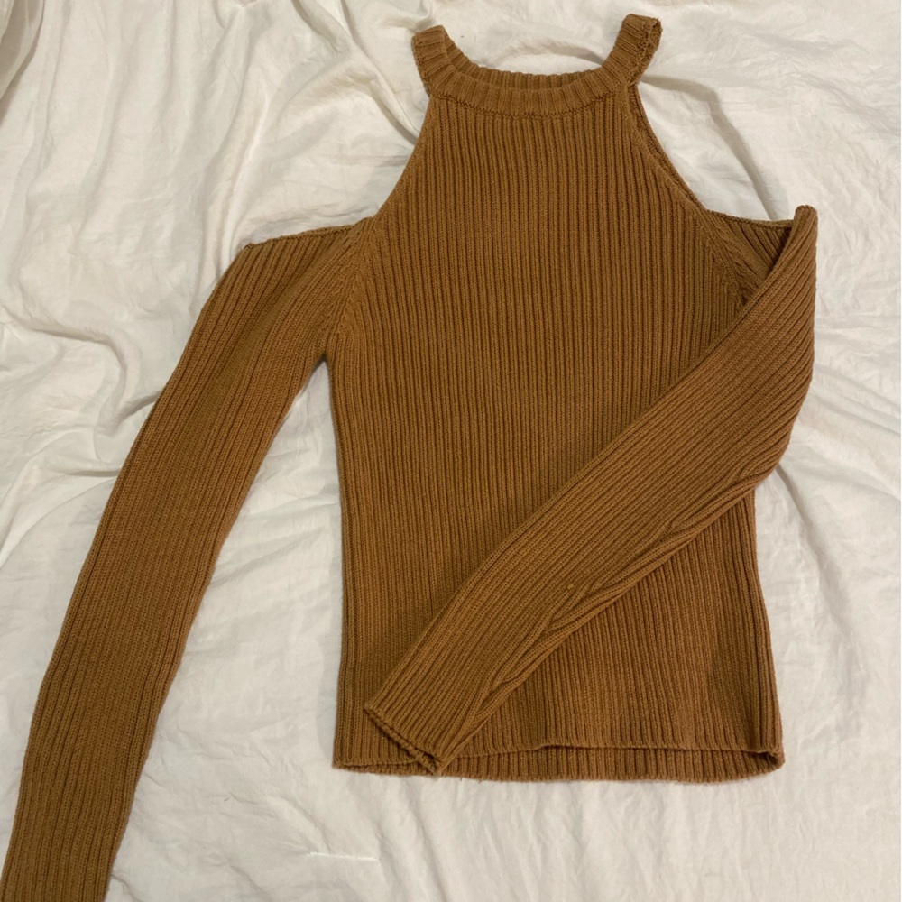 Sweater with shoulder cut outs